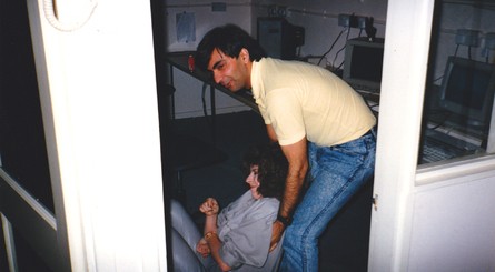 Jonathan Dunn and Steve Wahid play Operation Thunderbolt (top left). Steve Wahid is caught lifting Jane Lowe to her feet (top right). Dawn Drake gets interrupted while working (bottom left). And a picture of Arcade Alley at Ocean, where the programmers could play the arcade games that they planned to port (bottom right).