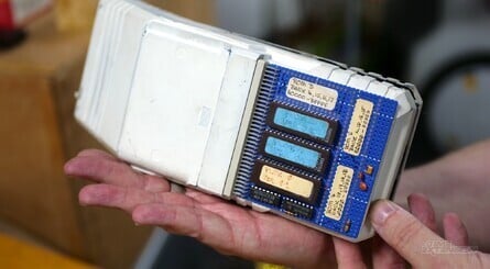 Cartridges slot into the back of the device, at the bottom. The cartridge shown here is a development cart, with 'Plok' clearly visible on one of the chips - this would later release on the SNES