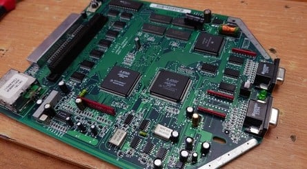 Simon has repaired many a Jaguar in his time, and is familiar with the inside of Atari's 64-bit beast. Yes, that is a piece of cardboard inside the machine – it's there to prevent the board shorting out within the Faraday cage