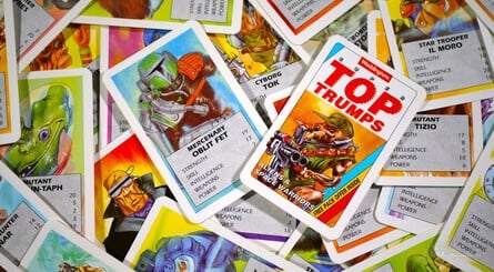 Clockwise, from top left: Goblins &amp; Faeriefolk features some lovely hand-painted art; the rear of the cards in Aliens &amp; Space Warriors; the all-important rules; check out this possibly copyright-infringing Boba Fett clone