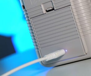 The CleanJuice battery pack removes the need to buy AA batteries (left), while the EverDrive GB X7 allows you to run ROMs from an SD card