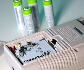 The CleanJuice battery pack removes the need to buy AA batteries (left), while the EverDrive GB X7 allows you to run ROMs from an SD card