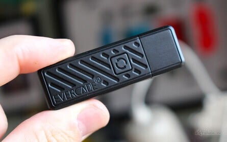 The USB dongle can be stored on the back of the controller thanks to the magical power of magnets