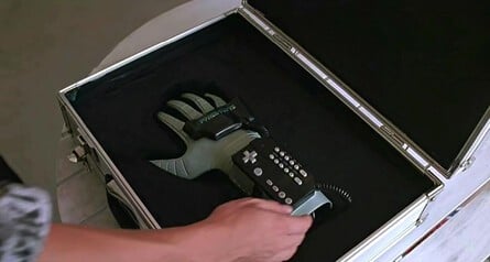 " I remember the security guy showing up with the Power Glove in a locked briefcase when we got our first look at it. I liked the idea so much that I gave the character Lucas Barton a similar case" - Todd Holland
