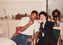 Left: The sell sheet for Punch Out!!, which was designed and conceived by Momoda. Right: images of Momoda, the Nintendo of America team, and Momoda with boxing legend Larry Holmes