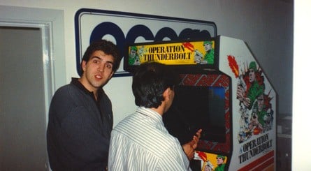 Jonathan Dunn and Steve Wahid play Operation Thunderbolt (top left). Steve Wahid is caught lifting Jane Lowe to her feet (top right). Dawn Drake gets interrupted while working (bottom left). And a picture of Arcade Alley at Ocean, where the programmers could play the arcade games that they planned to port (bottom right).