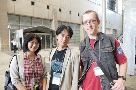 Left: a calm moment from the show floor. Right: meeting GameSide's Yusaku Yamamoto (middle)